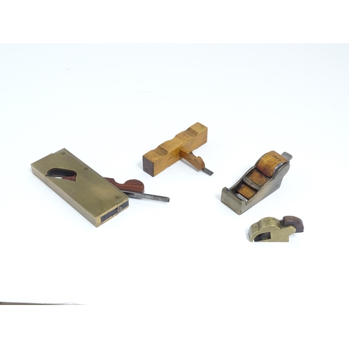 1201 - Four miniature woodworking / carpentry plane tools , comprising a Victorian brass chariot plane with... 