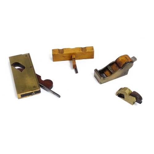 1201 - Four miniature woodworking / carpentry plane tools , comprising a Victorian brass chariot plane with... 