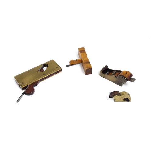 1201 - Four miniature woodworking / carpentry plane tools , comprising a Victorian brass chariot plane with... 