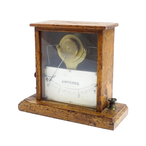 1204 - An early 20thC amperes / amp meter within a glazed case. Approx. 6 3/4