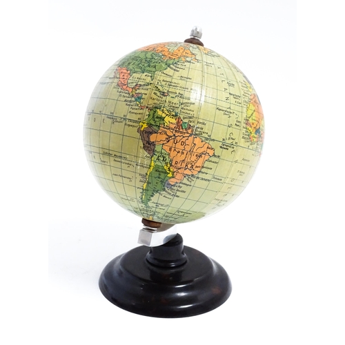 1211 - A small 20thC German desk globe by Politischer Erdglobus, on a Bakelite stand. Approx. 7 1/2