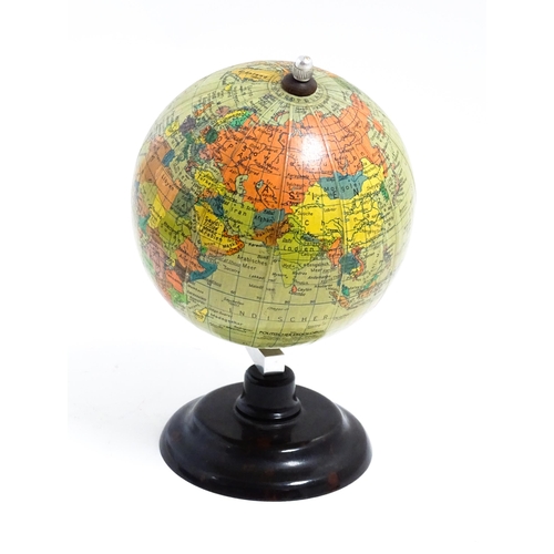 1211 - A small 20thC German desk globe by Politischer Erdglobus, on a Bakelite stand. Approx. 7 1/2