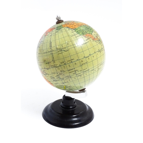 1211 - A small 20thC German desk globe by Politischer Erdglobus, on a Bakelite stand. Approx. 7 1/2