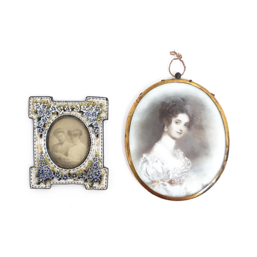 1219 - An early 20thC photograph frame with floral micro mosaic surround. Together with an oval porcelain p... 