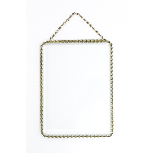 1220 - A 20thC bevelled glass hanging photograph frame with brass chain detail. Approx. 8 1/2