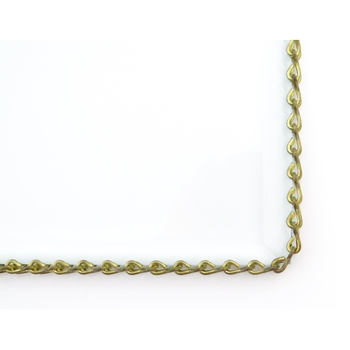 1220 - A 20thC bevelled glass hanging photograph frame with brass chain detail. Approx. 8 1/2