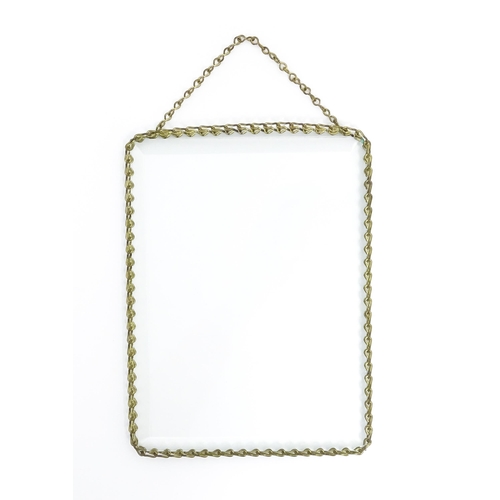 1220 - A 20thC bevelled glass hanging photograph frame with brass chain detail. Approx. 8 1/2