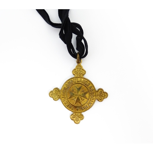 1222 - A quantity of St John's Ambulance items comprising a medal group of an Order of St John KstJ (with m... 