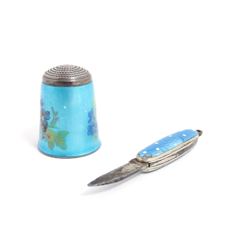 1228 - A silver thimble with turquoise guilloche enamel decoration, hallmarked Birmingham 1983, maker James... 