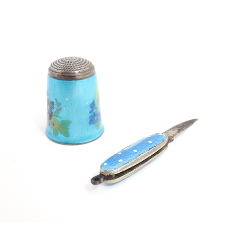 1228 - A silver thimble with turquoise guilloche enamel decoration, hallmarked Birmingham 1983, maker James... 