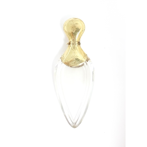 1229 - A 19thC glass scent bottle of teardrop form with Continental silver gilt mounts and hinged lid with ... 