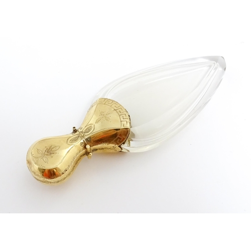 1229 - A 19thC glass scent bottle of teardrop form with Continental silver gilt mounts and hinged lid with ... 