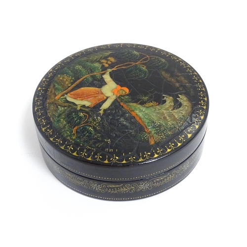 1230 - An early 20thC Russian pot and cover of circular form with hand painted decoration depicting a woman... 