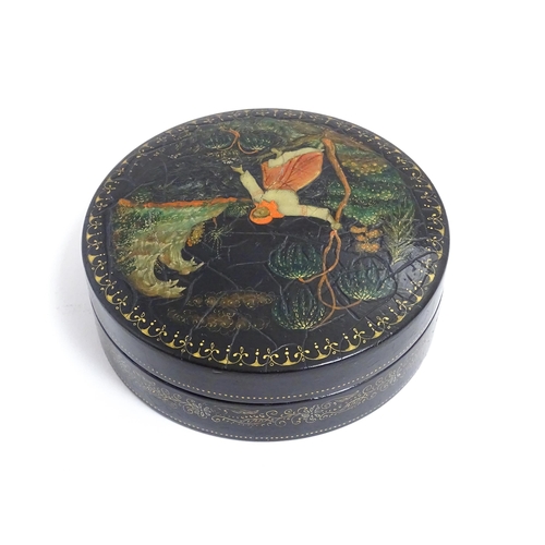 1230 - An early 20thC Russian pot and cover of circular form with hand painted decoration depicting a woman... 