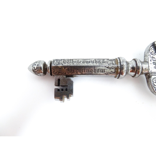 1237 - Two late 19th / early 20thC advertising keys by C. Smith & Sons the larger with engraved foliate dec... 