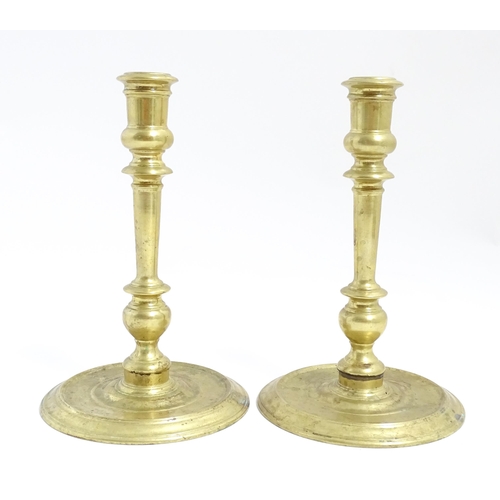 1249 - A pair of 20thC American brass candlesticks by Virginia Metalcrafters for Williamsburg Restoration. ... 