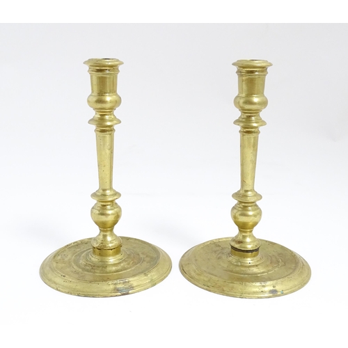 1249 - A pair of 20thC American brass candlesticks by Virginia Metalcrafters for Williamsburg Restoration. ... 