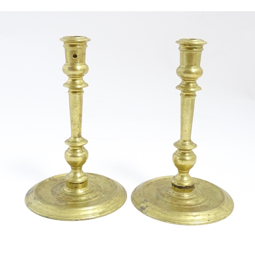 1249 - A pair of 20thC American brass candlesticks by Virginia Metalcrafters for Williamsburg Restoration. ... 