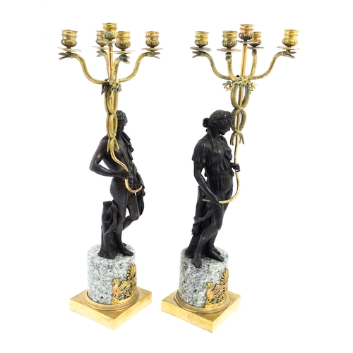 1257 - A pair of late 19th / early 20thC candelabras / candelabrum with cast bronze Classical figures suppo... 