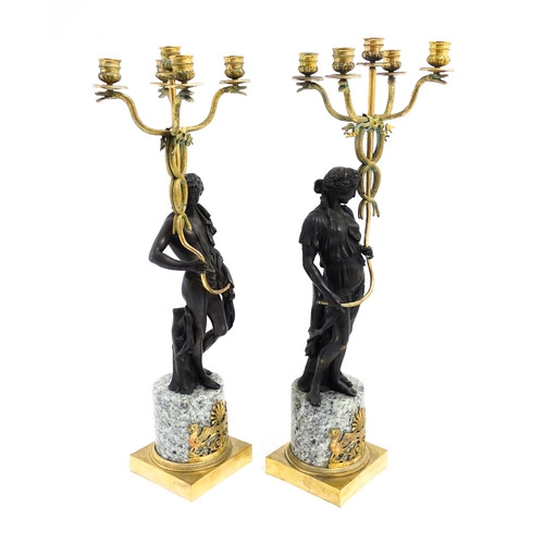 1257 - A pair of late 19th / early 20thC candelabras / candelabrum with cast bronze Classical figures suppo... 