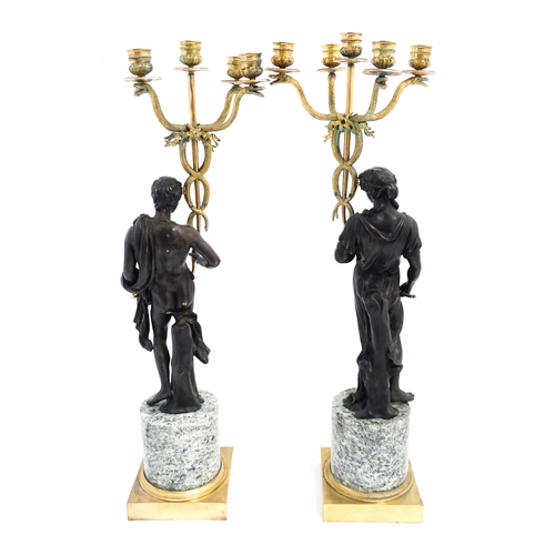 1257 - A pair of late 19th / early 20thC candelabras / candelabrum with cast bronze Classical figures suppo... 