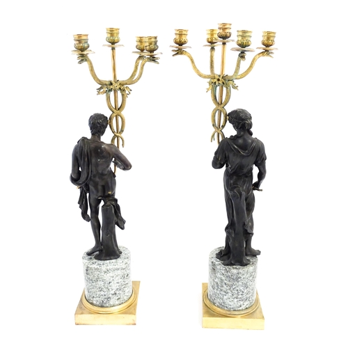 1257 - A pair of late 19th / early 20thC candelabras / candelabrum with cast bronze Classical figures suppo... 