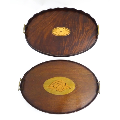 1262 - A Victorian mahogany tray of oval form with scalloped edge gallery, twin brass handles and inlaid sh... 