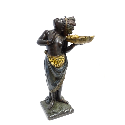 1270 - A 19thC carved and painted figural dumb waiter modelled as a female Blackamoor with feather headdres... 