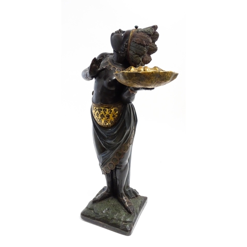 1270 - A 19thC carved and painted figural dumb waiter modelled as a female Blackamoor with feather headdres... 