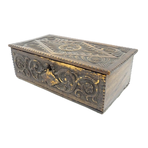 1271 - A 19thC oak bible box with carved floral and scrolling foliate detail. Approx. 5 3/4