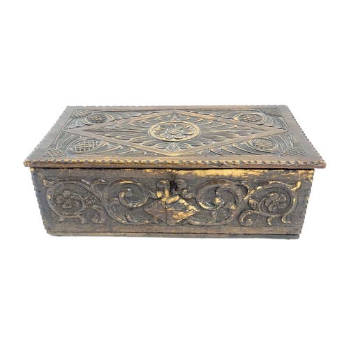 1271 - A 19thC oak bible box with carved floral and scrolling foliate detail. Approx. 5 3/4