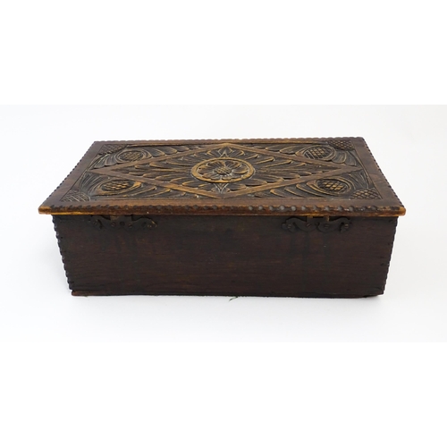 1271 - A 19thC oak bible box with carved floral and scrolling foliate detail. Approx. 5 3/4