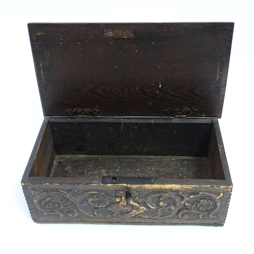 1271 - A 19thC oak bible box with carved floral and scrolling foliate detail. Approx. 5 3/4