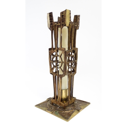 1273 - A large 20thC cast brass Modernist ecclesiastical / altar candlestick of abstract form, the base dec... 