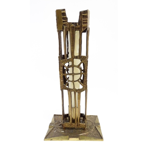 1273 - A large 20thC cast brass Modernist ecclesiastical / altar candlestick of abstract form, the base dec... 