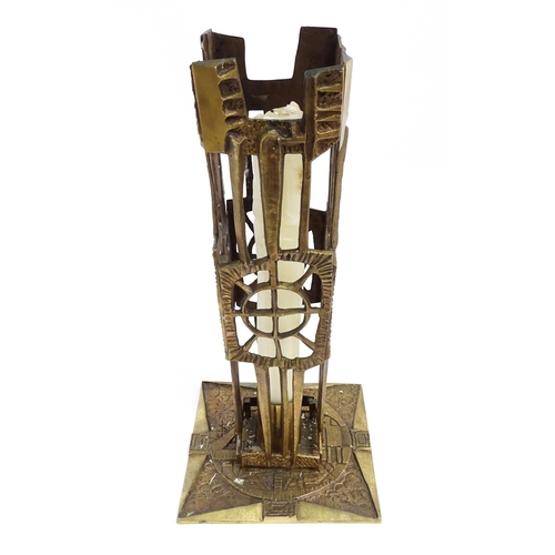 1273 - A large 20thC cast brass Modernist ecclesiastical / altar candlestick of abstract form, the base dec... 