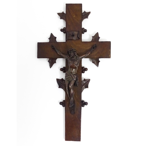 1274 - A 19thC carved hardwood crucifix with Black Forest style foliate decoration with applied cast Christ... 