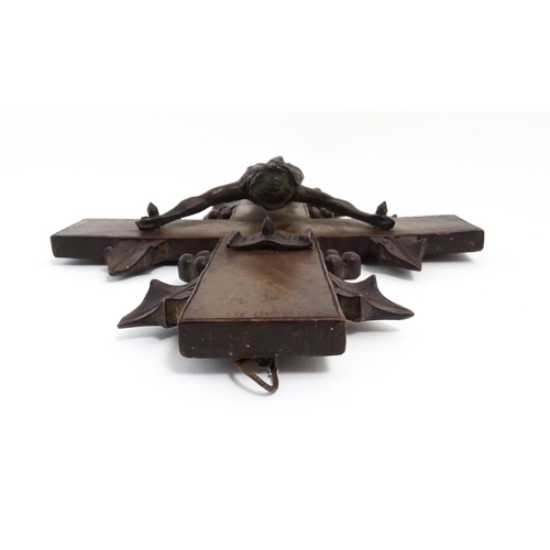 1274 - A 19thC carved hardwood crucifix with Black Forest style foliate decoration with applied cast Christ... 