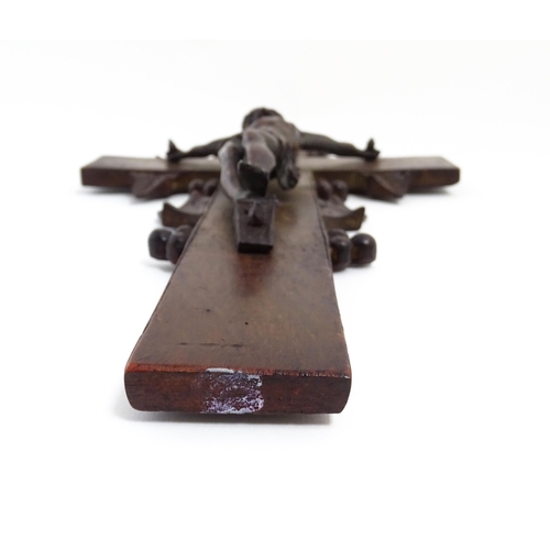 1274 - A 19thC carved hardwood crucifix with Black Forest style foliate decoration with applied cast Christ... 