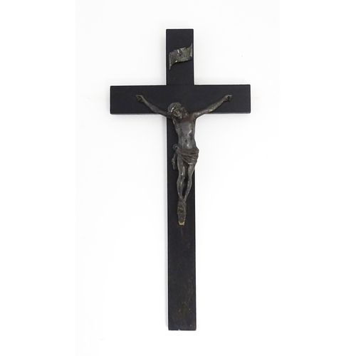 1275 - A 19thC ebonised crucifix with applied cast Christ / Corpus Christi. Approx. 16