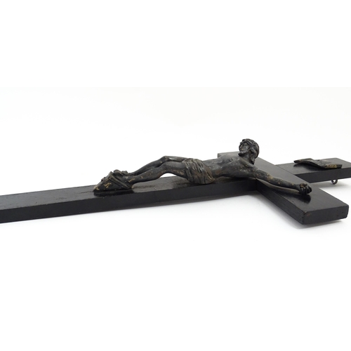 1275 - A 19thC ebonised crucifix with applied cast Christ / Corpus Christi. Approx. 16