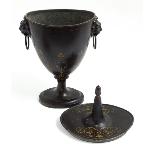 1276 - A 19thC toleware chestnut urn and cover with twin lion mask and ring handles, the simulated rosewood... 