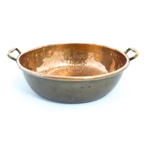 1278 - A large Victorian twin handled copper bowl. Together with three graduated pans one stamped Jones Bro... 