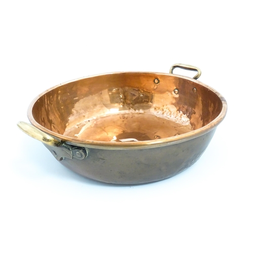 1278 - A large Victorian twin handled copper bowl. Together with three graduated pans one stamped Jones Bro... 