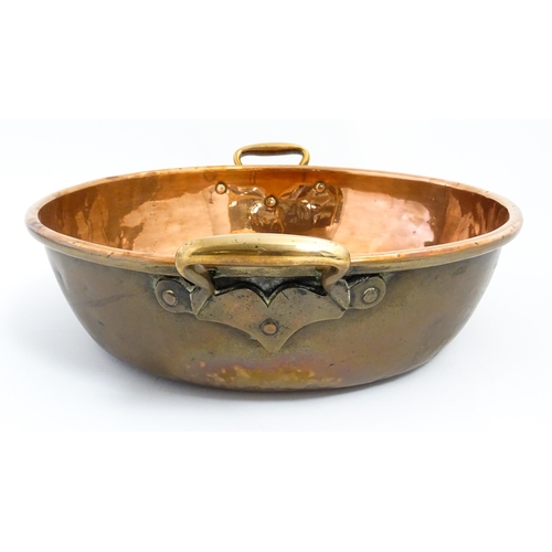 1278 - A large Victorian twin handled copper bowl. Together with three graduated pans one stamped Jones Bro... 