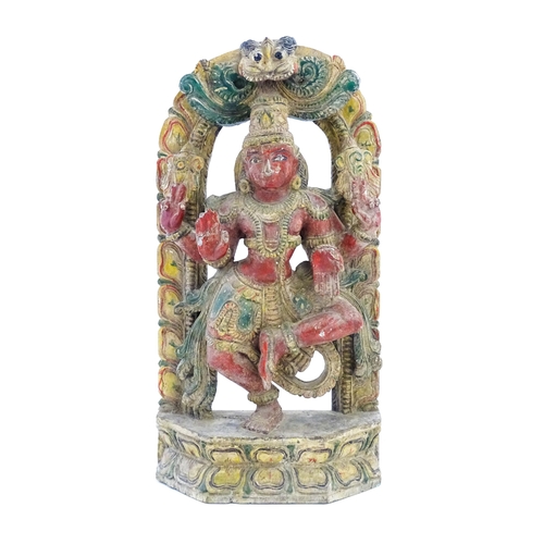 1289 - An Indian carved wooden model of a Hindu deity with gesso and polychrome decoration. Approx. 22 1/4