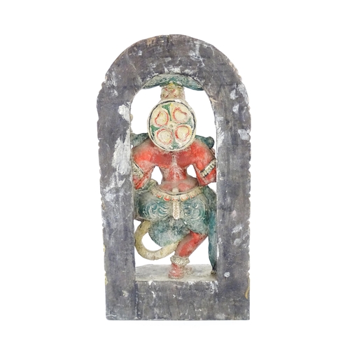 1289 - An Indian carved wooden model of a Hindu deity with gesso and polychrome decoration. Approx. 22 1/4