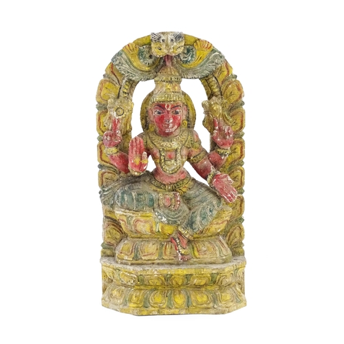 1290 - An Indian carved wooden model of a Hindu deity with gesso and polychrome decoration. Approx. 18