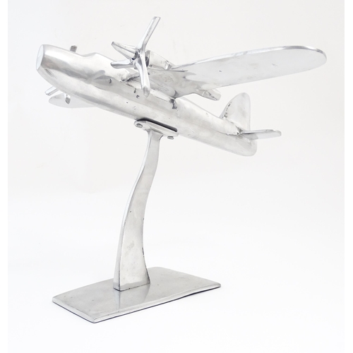 1292 - An Art Deco style cast model of a twin engine propeller aeroplane. Approx 10 1/8