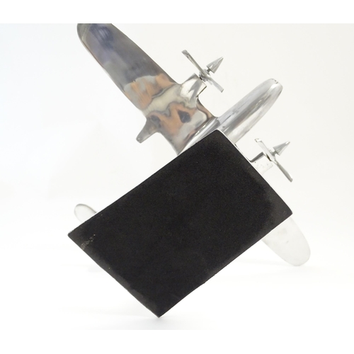 1292 - An Art Deco style cast model of a twin engine propeller aeroplane. Approx 10 1/8